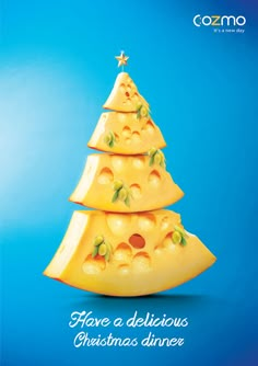 a christmas tree made out of cheese on top of a blue background with the words, have a delicious christmas dinner