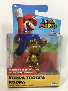 an action figure from the nintendo super mario series is shown in its packaging, and it appears to be gold