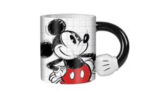 a mickey mouse coffee mug with a red and black minnie mouse on it's side