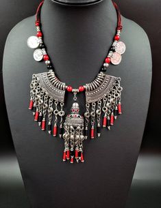 Stikingly dramatic Afghani coin necklace with metal fringe in oxidized silver, so as to create the patina of a vintage tribal piece. Has a modern, edgy vibe to it. Striking! Dramatic! Almost architectural! Strung on cotton cord, adjustable length using a sliding bead, to ensure a perfect fit for you! find even more awesome necklaces here: https://www.etsy.com/shop/BoutiqueByMaryam?section_id=21694658 check out the rest of my shop here: https://www.etsy.com/shop/boutiquebymaryam Bohemian Metal Necklaces For Festivals, Handmade Metal Coin Necklace For Festival, Antique Silver Necklaces With Silver Beads For Festival, Silver Bohemian Tassel Necklace As Gift, Metal Dangle Necklaces For Festivals, Handmade Silver Bohemian Coin Necklace, Bohemian Silver Tassel Necklace Gift, Handmade Alloy Dangle Necklace, Silver Necklaces With Dangling Beads For Festivals