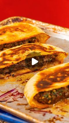 three quesadillas sitting on top of a pan