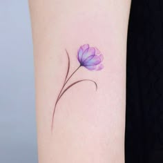 a small purple flower on the left side of the arm, with watercolors