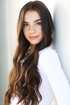 a beautiful young woman with long brown hair