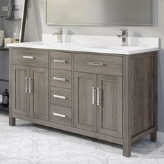 a bathroom vanity with two sinks and a large mirror over the sink in front of it