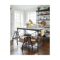 a kitchen island with stools in front of it and shelves on the wall behind it