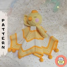 a crocheted stuffed animal sitting on top of a white blanket with the words pattern below it