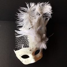 White masquerade mask women / white feather masquerade mask / | Etsy Elegant Feathered Masquerade Mask, Elegant White Masquerade Mask For Carnival, Elegant Feathered Eye Mask For Masquerade, Elegant White Masquerade Mask For Mardi Gras, White Masquerade Masks And Prosthetics For Mardi Gras, White Masks And Prosthetics For Mardi Gras Masquerade, White Mardi Gras Masquerade Masks And Prosthetics, Elegant White Masquerade Mask For Weddings, White Carnival Eye Mask