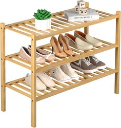 a wooden shoe rack with several pairs of shoes on it