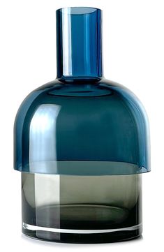 a blue glass bottle with a black top