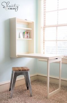 a white desk with a shelf above it and a wooden stool in front of it