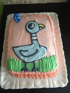 a birthday cake with a bird on it