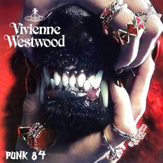 an advertisement for a punk band with teeth and rings on their face, in front of a red background