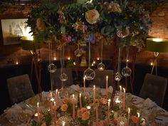 the table is set with candles and flowers