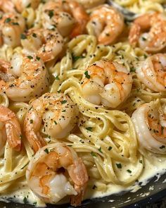 pasta with shrimp and parmesan cheese in a skillet ready to be eaten