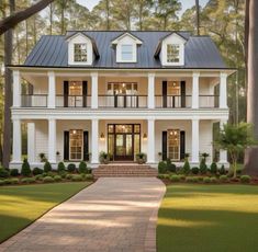 a large white house with black shutters on the front and side windows, surrounded by trees