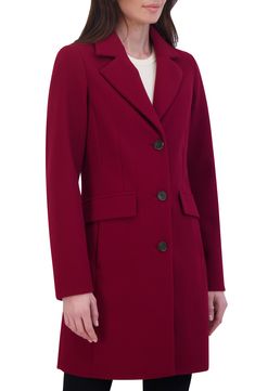 Stay warm in this water-resistant coat fashioned with notched lapels, princess seams and flap pockets for polished style. 35 1/2" length Front button closure Notched lapels Front flap pockets Lined 100% polyester Dry clean Imported Single Breasted Long Coat For Career, Notched Outerwear For Career In Fall, Burgundy Lapel Collar Outerwear For Fall, Burgundy Outerwear For Business In Fall, Burgundy Business Outerwear For Fall, Burgundy Lapel Collar Outerwear For Winter, Burgundy Outerwear With Lapel Collar For Winter, Fall Burgundy Single Breasted Outerwear, Burgundy Single Breasted Outerwear For Work