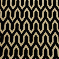 a black and white rug with wavy lines on it