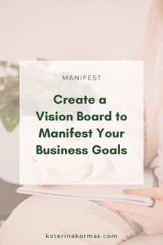 a woman holding a tablet with the text create a vision board to manfest your business goals