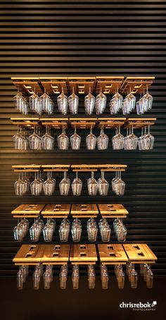 the shelves are filled with many glasses and cups on them, as well as wooden crates