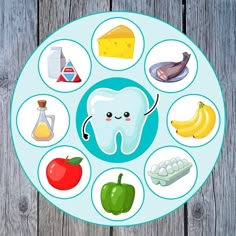 a plate with different foods on it and an image of a tooth in the middle