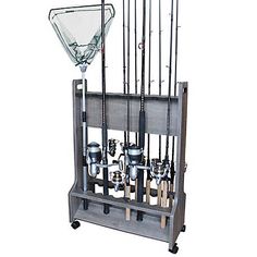 a fishing rod holder with several rods and lures in the center, on wheels