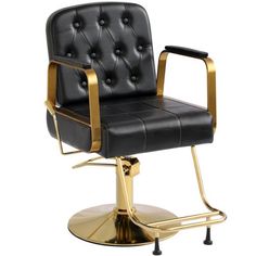 a black and gold barber chair on a metal base with the seat upholstered