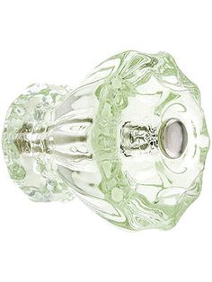 a green glass door knob on a white background