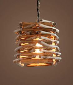 wood stick loft lamp Driftwood Pendant Light, Lights Diy, Drift Wood Lighting Ideas, Diy Hanging Light Fixtures Wood, Driftwood With Hanging Lights, Unusual Pendant Lights, Drift Wood Ceiling Lights, Wood Lighting Design, Tiki Lights