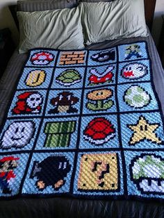 a crocheted blanket made to look like nintendo characters