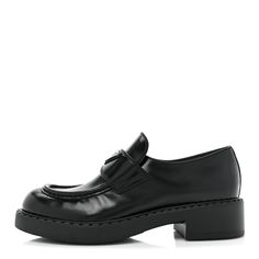 This is an authentic pair of PRADA Spazzolato Metal Triangle Logo 50mm Loafers size 38.5 in Black. These stylish loafers are crafted of black leather with black stitching, a silver Prada emblem, and rubber soles. Triangle Logo, Prada, Black Leather, Loafers, Stitching, ? Logo, Silver, Leather, Black