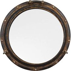 a round mirror is shown against a white background and has rivets on the edges