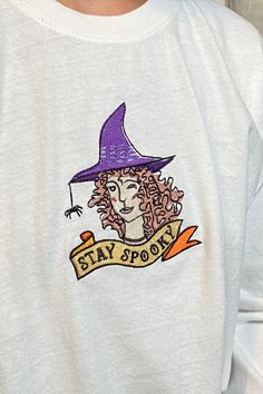 "Stay Spooky" Witch design embroidered on a 100% cotton long sleeve white t-shirt. Perfect for spooky season! Unisex size M. 100% cotton. Everybody.world white long sleeve trash tee, made from 100% recycled cotton. Purchased second hand in perfect condition. Machine wash cold and air dry. Copyright ©2020 Sara Vetser. All rights reserved. Spooky Embroidery, Embroidery Halloween, Spooky Season