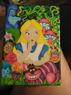 a painting on the side of a person's leg with an alice mouse and other characters