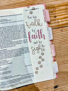 an open bible with the words for we walk by faith not by sight