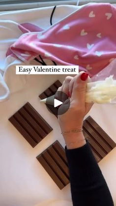 a person is holding something in their hand with the words easy valentine treat on it