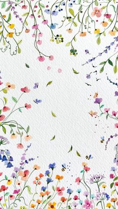 watercolor flowers on white paper with green leaves and purple, pink, blue, yellow, orange