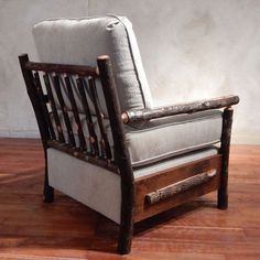 a wooden chair sitting on top of a hard wood floor