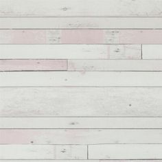 white wood planks with pink paint on them