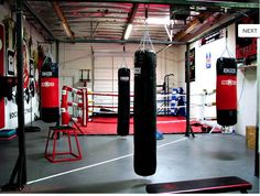 a gym with boxing gloves and punching bags