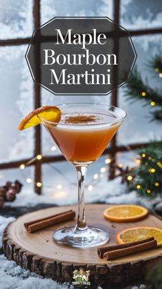 the maple bourbon martini is served in a coupe glass with an orange slice and cinnamon garnish