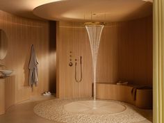 a bathroom with a circular shower head in the center