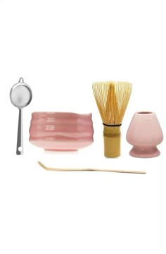 three different types of decorative items on a white background, including a brush and spoon