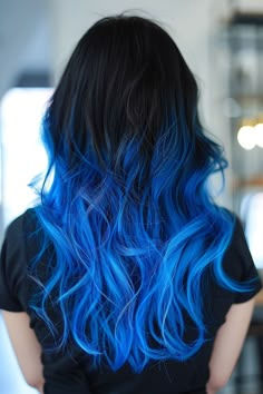 Jet black to electric blue ombre for a vibrant, eye-catching color transition, offering a bold and dynamic look that’s both modern and striking. Black And Electric Blue Hair, Blue Hair Dye Ideas Short Hair, Black Roots Blue Hair, Brown To Blue Hair, Black And Blue Ombre Hair, Blue Hair Ends, Black And Blue Hair Ideas, Black To Blue Ombre Hair, Black Hair Blue Tips