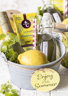 a bucket filled with lemons and other items