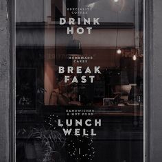 there is a sign in the window that says drink hot break fast and lunch well