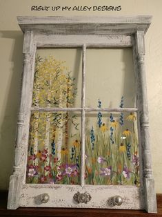 an old window with flowers painted on the windowsill and saying, repair up my alley designs