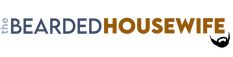 the bearded housewife logo is shown in brown and blue letters on a white background