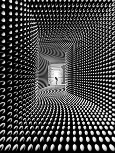 an abstract black and white photo with circles in the center, looking like a tunnel