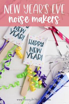 new year's eve noise makers with streamers and confetti on the table