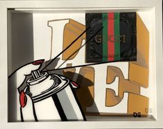 an art piece is displayed in a white frame with black and red stripes on it